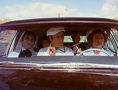 Somewhere there's a Alex Cox script about a fat-farm doctor, a failed sea captain, a murderous husband, an Indian orchestra conductor, and a lady nurse with a penis riding in the same car; but they're together for a totally different reason.