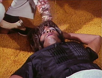 It’s a man, and some piss-yellow shag, and a really nice shoe.